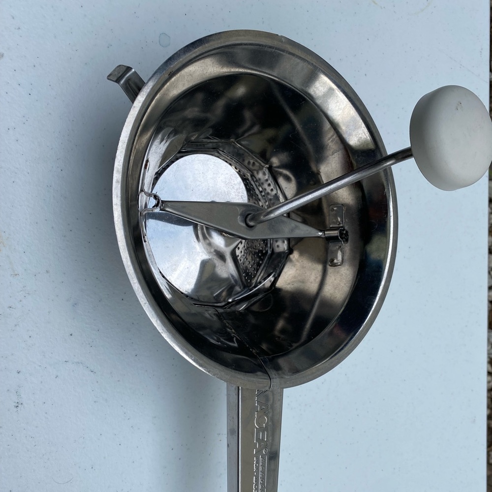Vintage strainer with handle and grinder